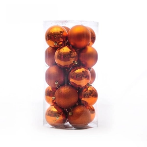 Détail de boules de Noël orange 4cm avec finitions brillantes, mates et pailletées en tube