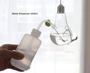 Close-up of 250ml squeeze bottle watering a hanging lightbulb-shaped glass vase