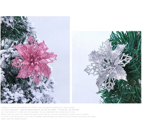 Detail of pink and silver 10cm glitter artificial Christmas flowers on snowy tree branches