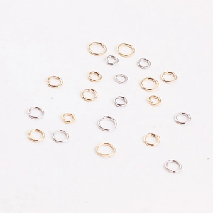 Macro shot of assorted gold and silver jump rings for DIY jewelry making accessories