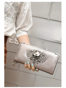 Detailed silver skull purse featuring intricate metal carvings and punk gothic texture