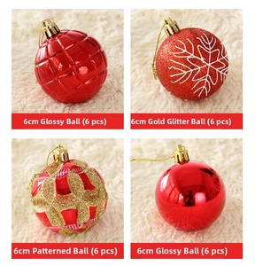 Detail view of 6cm red Christmas baubles with shiny glitter and embossed textures