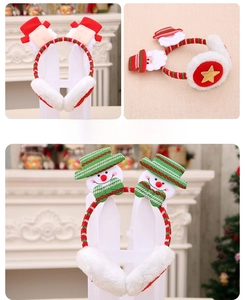 Detail of plush Christmas earmuffs featuring cute Santa Claus and snowman top decorations