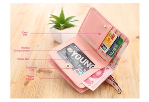 Detailed interior of a pink PU leather wallet with card slots and zipper compartment