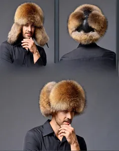Detail view of brown fox fur Ushanka hat with black leather top and thick ear flaps