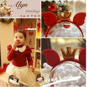 Detail of red wings and gold crown on the cute Christmas headband for girls
