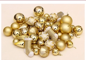 Detailed view of golden Christmas ornaments in matte, shiny, and glittery finishes