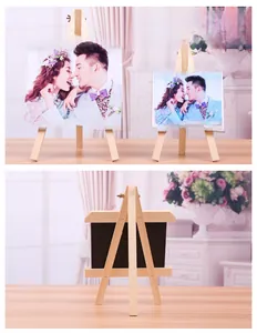 Detail of pine wood mini photo frames with laser engraving and tripod stand design