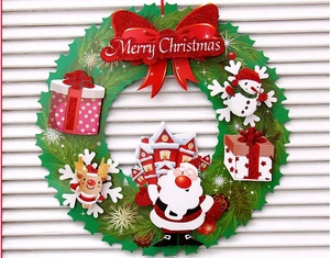 Detail view of 3D paper Christmas wreath with Santa, reindeer and snowman decorations