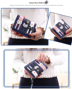 Detailed view of women's bi-fold wallet featuring three cartoon cats and striped PU leather