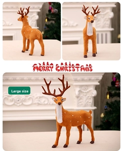 Close-up of large brown flocked Christmas reindeer figurine with white spots and antlers