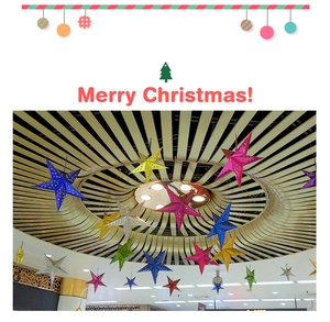 Detailed view of colorful 3D laser hollow star decorations hanging from a ceiling