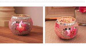 Detail of pink mosaic glass candle holder featuring intricate star pattern and elegant craft