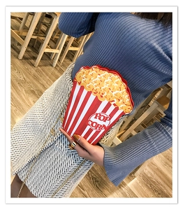 Creative popcorn bucket crossbody bag with red and white stripes and gold chain strap
