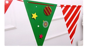 Detail of Christmas triangle bunting flags with red, green and gold festive patterns