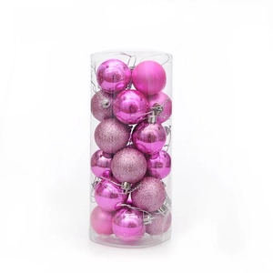 Boules de Noël roses en cylindre avec finitions mates, brillantes et pailletées