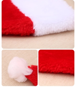 Macro detail of plush red and white fabric texture and soft pompom on Christmas hat