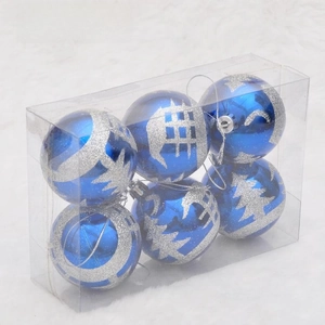 Detail of 6 bright blue Christmas balls with silver cedar tree patterns in clear box