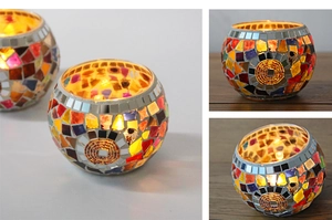 Close-up of a mosaic glass candle holder with vibrant patterns for wedding decor