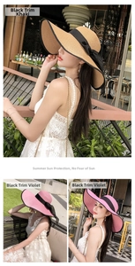 Detail of wide brim straw hats with black ribbons in khaki and violet for sun protection