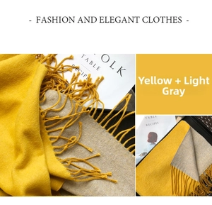Detail shot of yellow and light gray double-sided scarf with elegant tassel fringe
