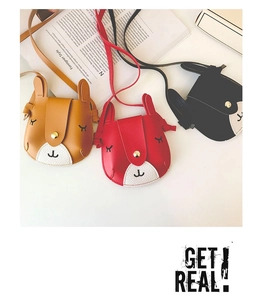 Detail of cute bunny mini shoulder bags in brown, red and black colors for girls