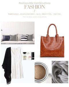 Detail view of large brown vintage faux leather tote bag with elegant texture and handles