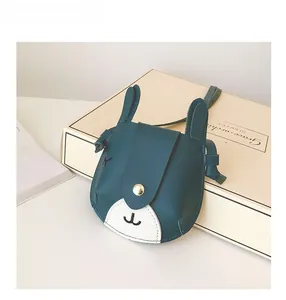 Detail of cute rabbit crossbody bag for girls showing PU leather texture and snap button