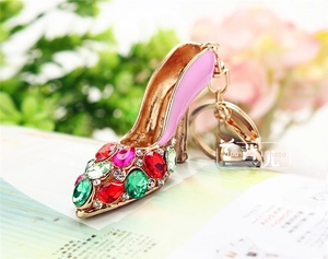 Macro view of crystal high heel keychain with pink enamel and sparkling rhinestones
