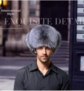 Close-up of thick fox fur trapper hat for men with protective ear flaps for winter