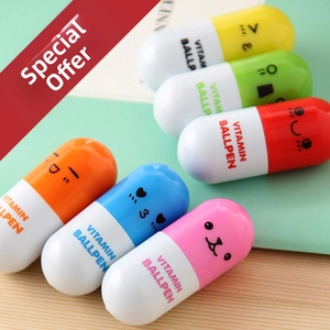 Macro detail of vitamin-shaped pill pens in six bright colors on a wooden table