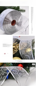 Detailed view of silver glitter scroll pattern on translucent Christmas mesh ribbon wrap
