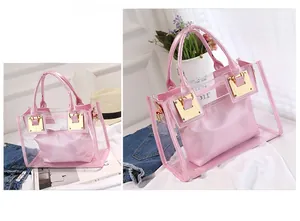 Detail of light pink transparent jelly beach bag with inner pouch and gold hardware