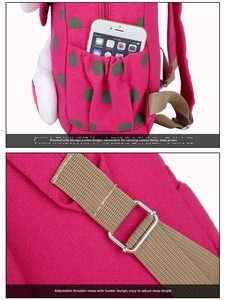 Detail of pink canvas kids backpack with polka dot side pocket and adjustable metal buckle
