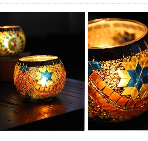 Detailed close-up of colorful mosaic glass candle holder with intricate star and wave patterns