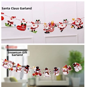 Detail of Santa Claus and snowman paper flags for Christmas party decoration hanging on wall