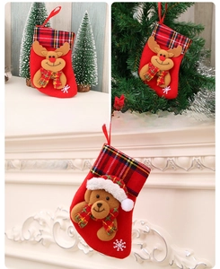 Detail of Christmas stocking featuring 3D plush bear and reindeer with snowflake embroidery