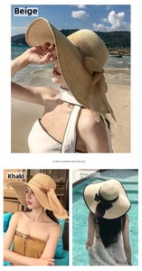 Detail of wide brim straw hat with elegant bow ribbon in beige and khaki for beach vacations