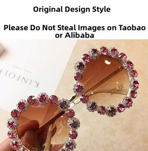 Detail of oversized round sunglasses with pink crystal rhinestones and gradient lenses
