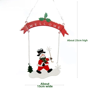 Detail of Christmas metal snowman hanging sign with Welcome banner and holly leaves