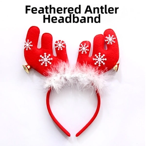 Detail of red Christmas reindeer headband with white feathers, snowflakes and small gold bells