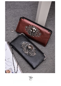 Gothic skull embossed long wallet in textured leather with metal corner guards and chain