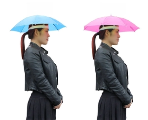 Detail view of sky blue and rose red folding head umbrellas for outdoor fishing