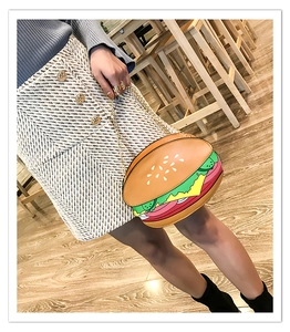 Creative hamburger-shaped PU crossbody bag with gold chain shown on a model