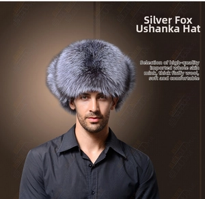 Detailed close-up of thick silver fox fur on windproof earflap hat for winter warmth