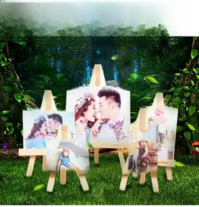 Detailed view of three sizes of creative wooden easel picture frames with engraved text