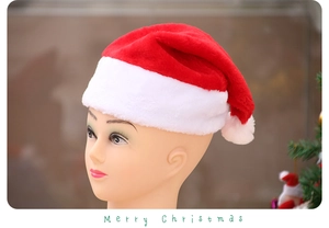 Close-up of a classic red plush Christmas hat with white pompom on a mannequin head