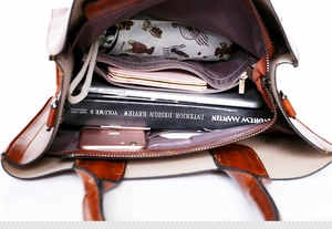 Top view of brown leather tote bag interior showing large capacity and compartments