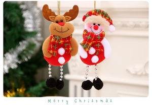 Detailed view of plush reindeer and snowman ornaments with red plaid scarves and beads
