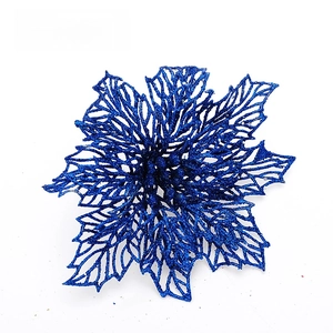 Detail view of royal blue glittered hollow Christmas flower ornament for holiday tree decoration